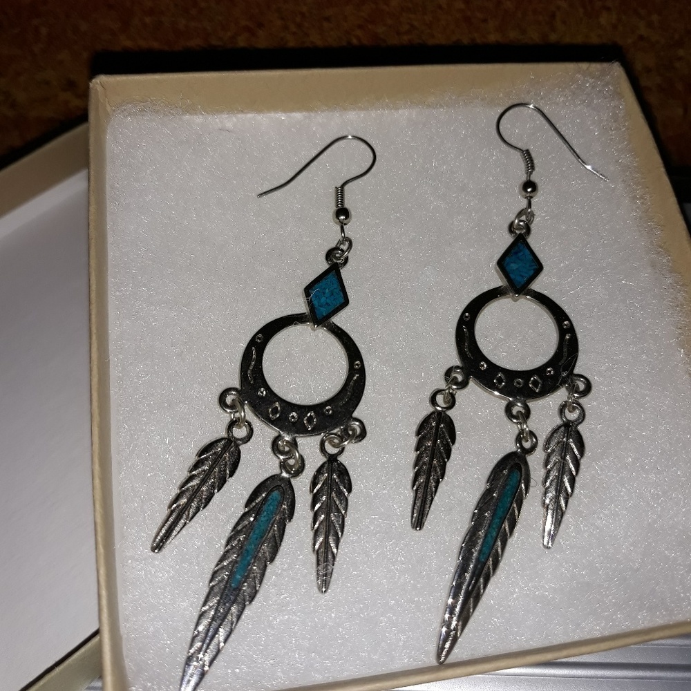 Pair of silver feather dangle earrings